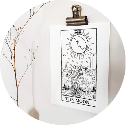 A print of the Moon tarot from the Rider Waite deck in black and white.